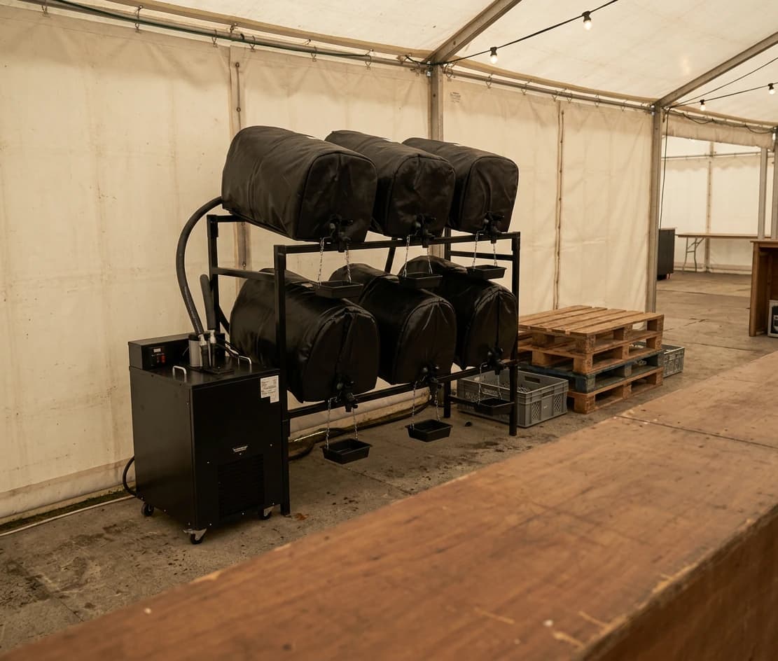 Community Pub Beer Festival Starter Kit set up in a marquee - six casks racked with piped cooling jackets and taps, ready to pour